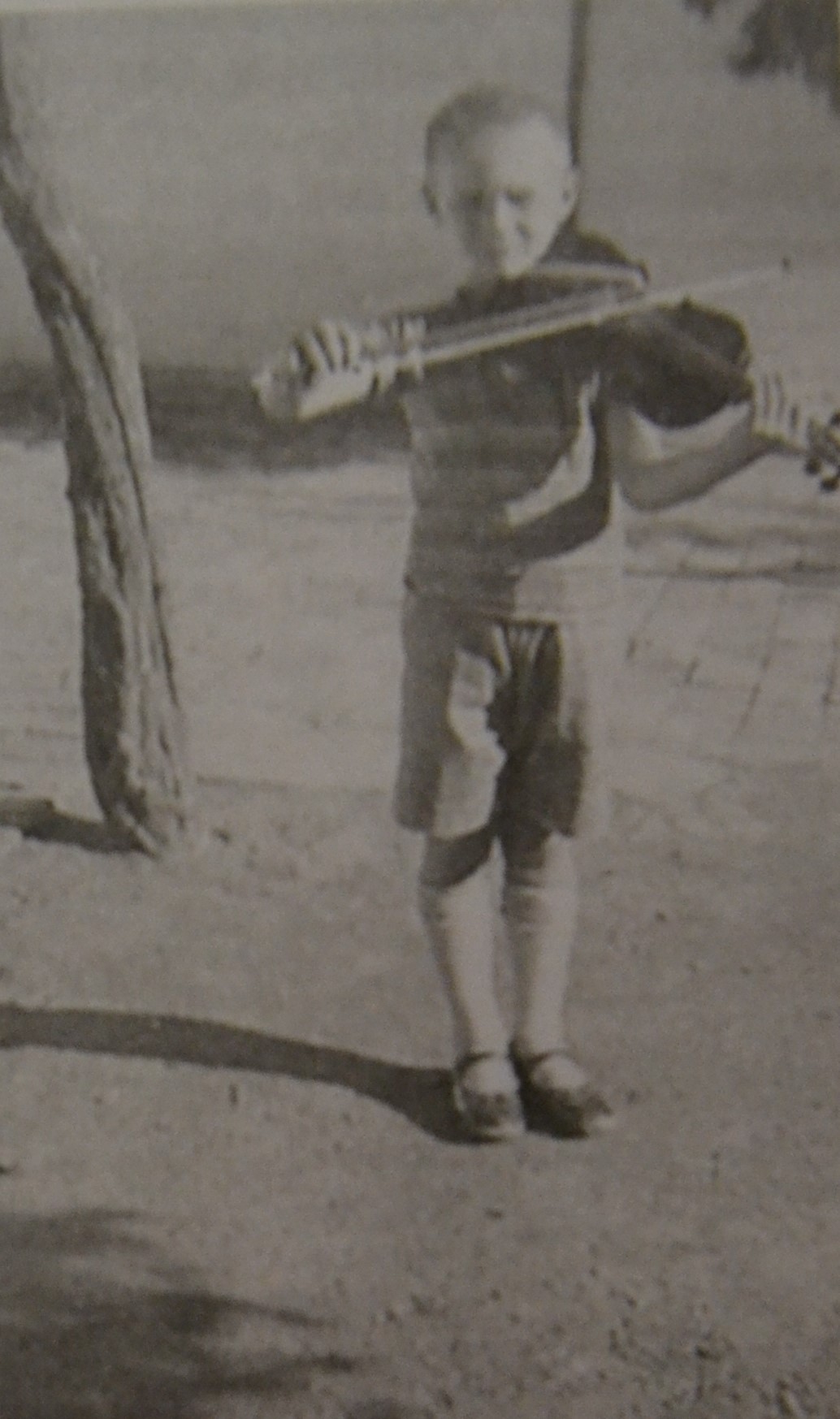 Playing violin in 1930s