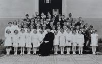 Ladislav Tichý among the children who have just recieved their first Holy Communion 