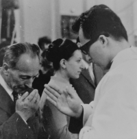 Ladislav Tichý after his first Holy Mass in St. Vavřinec church in Olešnice, giving his first blessing to his father, Ladislav Tichý 
