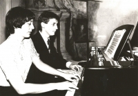 With wife Jitka playing a piano, hall of the Palác Straků z Nedabylic, 1986