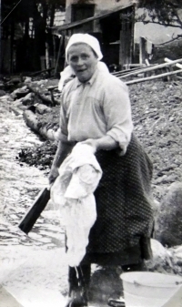 Jiří Langer / journey 1957 / Zuberec resident Mrs. Štefuláková washes clothes / Slovakia 