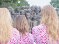 Choir girls in front of the memorial (2015)