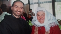 Marie with a monk, her grandson Robert's friend