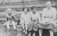 Vít Pelikán on the left with siblings and housewife Hanička