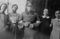 Marie Halfarova's husband Arnošt as a soldier of the Wehrmacht with his sisters and other relatives, World War II