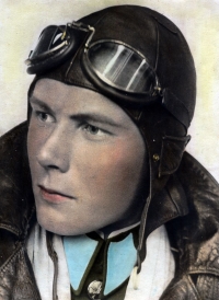 Coloured photograph of Jan wearing an one-piece coverall flying suit