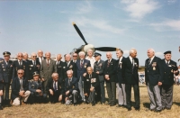 A beautiful group photo from the very first Memorial Air Show in Roudnice nad Labem on the 23th September, 1991. It was a wonderful event for our airmen and the founder and airport director, Vlasta Dvořák, put his heart into organising this event not only that year but for many years after. The event got called "Second Britain", even. The truth is, for the air fans, the event is made rarer by happening only every other year.
Iveta cannot remember all the names after so many years. After the parked Hurricane from The Netherlands, she recognised her dad (second from right) and his colleague from the B-24, Ivan Schwarz (United Kingdom), at her dad's right, colonel Petr (United Kingdom), further from him, Viktor Kent (United Kingdom), colonel Antonín Vendl, and in the RAF uniform, colonel Dvorský. In the centre under the propeller, colonel František Fajtl with his indispensable goatee. From the left, Iveta can identify colonel Krézek (second from left), colonel J. Hofrichter (fourth from left), in grey suit next to him, another pilot legend, colonel Karel Šeda. From those sitting, she can recall colonel J. Vyhnis (who was born in Stod) and fourth from left, František Knap.