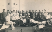Antonín Špika in the army hospital, with both arms bandaged.