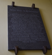A plaque commemorating victims of the Second World War, a secondary school students 