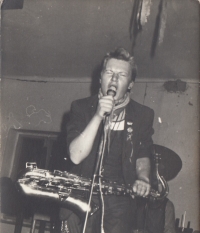 Photo from an illegal concert, Štěpán Málek with a saxophone, Jeřice, 1984
