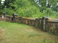 Tombstones in the wall around the Všenory church