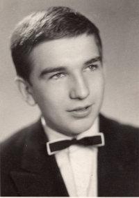 As an eighteen-year-old, a high school graduation photo 