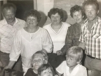 Emilia Sasinova, second from the right in the upper row with sisters and mother, lower row on the left