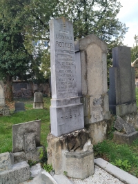 The tomb of the witness's grandfather, Leopold Rotter, in Brno's Jewish cemetery. The tombstone lists the family members who perished during the Holocaust. It is also interesting to note the post-war removal of the original German inscriptions "geboren-gestorben" from the time when the names of the perished relatives were inscribed on the stone