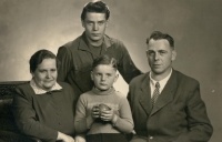 With his brother and parents after the war