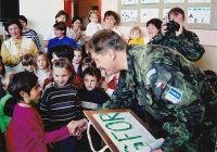 Radek Henner in 2000 with children at international peace mission SFOR in Bosnia and Herzegovina