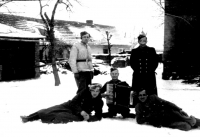 Friends from the transportation unit, Josef Toman in the middle with an accordion; Bedřich Kyselka lying on the left; Josef Příšovský in a white blouse; Václav Kačerovský lying on the right; Václav Holoubek standing on the right; Žatec 1945
 

