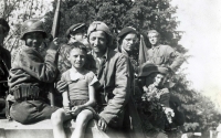 With his father on an armored transporter of rebels, May 1945
