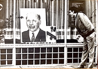 Emil Sedlačkosticking his tongue out at the photograph of the German politician Walter Ulbricht