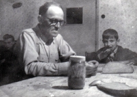 Jan Tichý with father in the kitchen at the family farm / around 1957