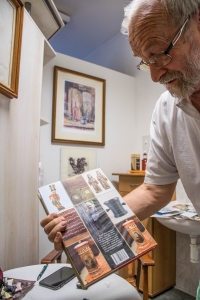 Anton Bartunek shows his book History of Slovak Pharmacy.