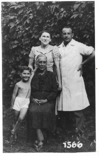 Marika with her parents and grandmother.
