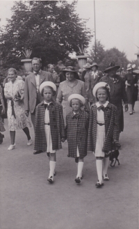 All three girls in their uniforms were sometimes difficult to recognize by their mother 