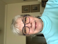 Hana, and in her background a photo of her grandparents.

