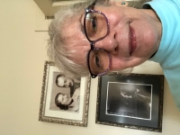 Hana, and in her background a photo of her poor father and mother.

