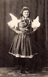 His mother, Anna, in a folk costume 
