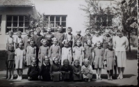 Ana (the third left in the first line) at the end of the first school year in 1960