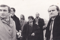 Alexandr Neuman (fourth from right) surrounded by President's advisors, among them Michael Kocáb. Photograph: Tomki Němec