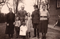 With his siblings, parents, grandmother and grandfather