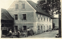 The mill in 1930s, his grandparents standing in front of the house 