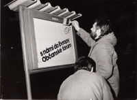 Putting up posters over the communist boards – Josef Brychnáč, Pardubice 1990