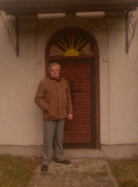 Josef Zíka in front of a Šumava church