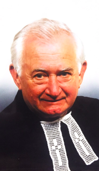 A contemporary photograph of Professor Dušan Ondrejovič in canonical dress.
