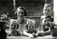 With his mother and sisters