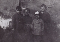 Far left, Jan Zábrana who later became a writer and a translator, far right, František Vondráček. The girl in a cap is Věra Metzlová, who later perished in a concentration camp.