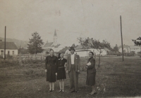 Standing on the village square are Milada Linhartová between her parents, the woman standing aside was a visitor 