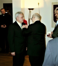 Decorating with a Golden Cross for his merit at the Polish Embassy