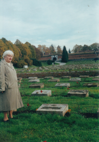 By his father's grave in Terezín, with his wife Dagmar, October 2000 