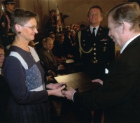 Marie Svatošová receiving the Medal of Merit from President Václav Havel, 2002
