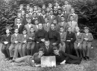 Grammar school in Velehrad, 1945/6, third year alone: K. Ševela and B. Janíček. In the middle above the board Vl. Ovčáčík, sitting: third Jan Rybář, 1st row standing the first Josef Jakubec, the third Frant. Čupr (brother of Josef). 2nd row in the middle Hladiš