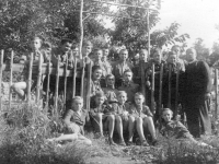 Holiday scout camp in Mlýnky near Sudoměřice, on the right Ševela, on the left next to him J. Rybář, on the right sitting in the entrance Vl. Ovčáčík, lying on the left St. Peroutka. In the middle of the entrance standing "on a hedgehog" Ant. Ott alias "Our Tonda from the kitchen", later a minorite Fr. Alexandr, + as a pastor in Veselí n. Mor.