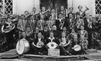 Brass ensemble: sitting right Pavel Ševela - horn. 2nd row: second from left Vl. Ovčáčík - clarinet, third J. Hladiš - clarinet, Karel Ševela. 3rd row: (excluding bass) second J. Stojaspal. Top row second from the right Ant. Krejčiřík - trombone, 1948/9