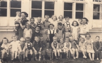 Marie Štráchalová in a school in Záblatí (in the middle with braces), to her left is her brother Vašíček (circa 1951)
