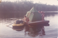 David and Jakub, sons of the witness, in front of a tent on a raft, near the cabin, 1978