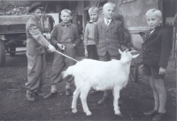Jaroslav (second from the right) with a goat and friends, Velim, cca 1949