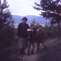 At their grandmother's in Slovakia, mushroom picking with grandmother and sister Evička, 1966